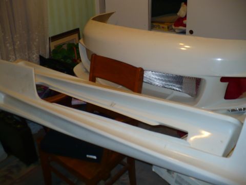 1993 Ford Probe - Car body kit parts are visible indoors, with a watermark at the bottom right.