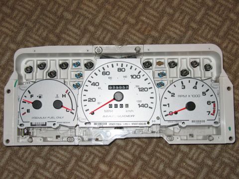2000 Ford Crown Victoria - This instrument cluster displays fuel level, speed, and RPMs, with 'MAUDER' text visible.