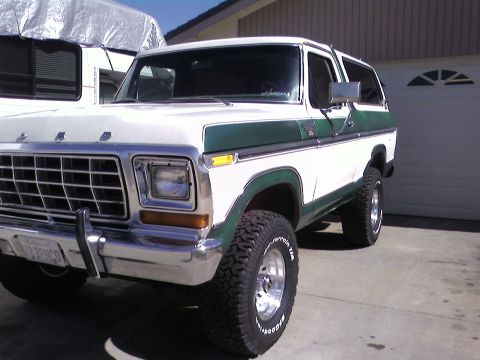 1978 Ford Bronco - This 1978 Ford Bronco features a two-tone white and green paint scheme and a prominent chrome grille.