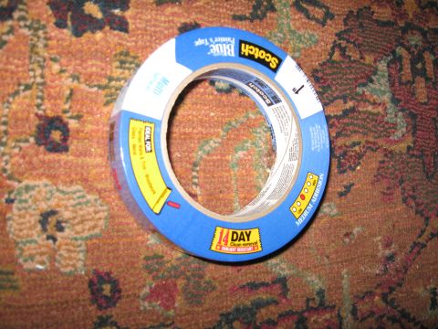 2004 Ford Crown Victoria - A roll of Scotch Blue Painter's Tape is shown on a patterned carpet.