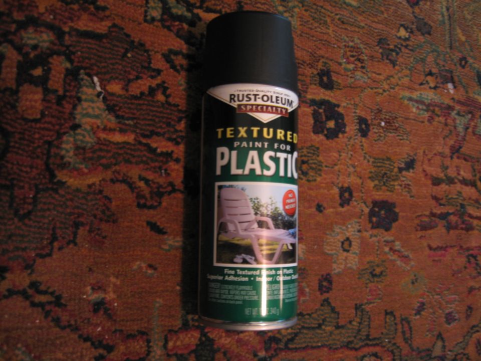 Can of Rust-Oleum textured paint for plastic, sitting on a patterned rug