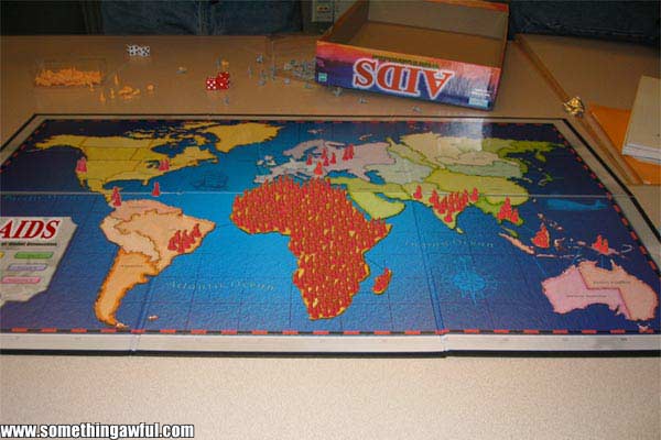 AIDS board game laid out on a table with world map