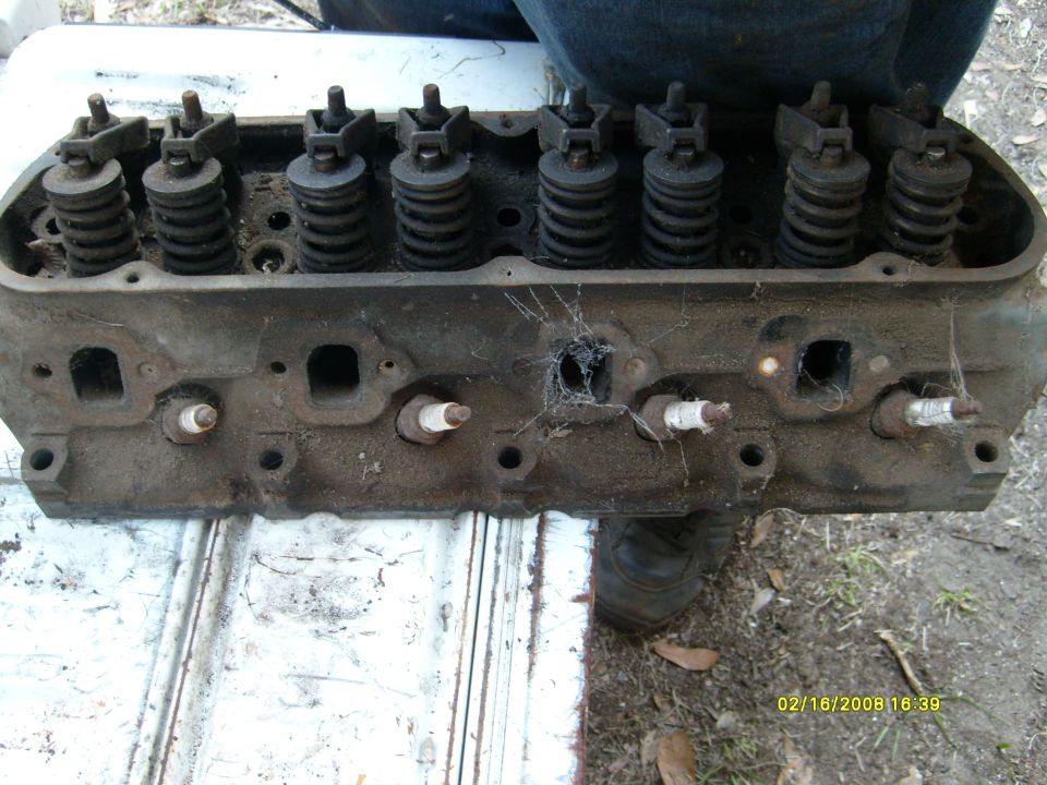 Used cylinder head with valve springs and spark plugs installed
