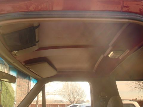 1992 Ford Bronco - View of the interior ceiling, showing the headliner, sun visor, and overhead light fixture.