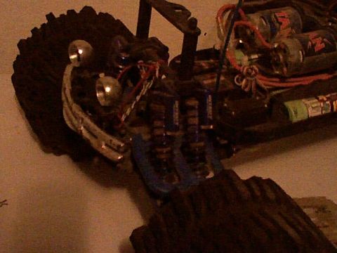 1991 Ford Bronco - The internal components of a remote control car are visible, including the motor, battery pack, and suspension system.