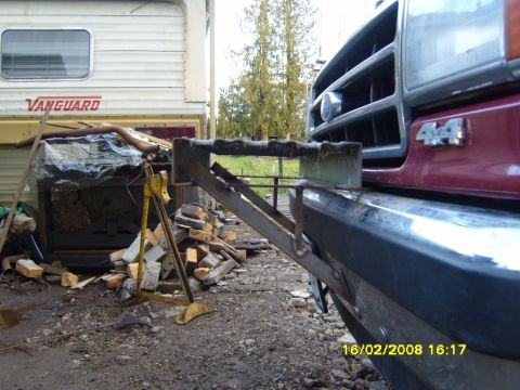 1989 Ford Bronco - A custom bumper attachment is mounted to the front of a pickup truck. A Vanguard trailer is visible in the background.