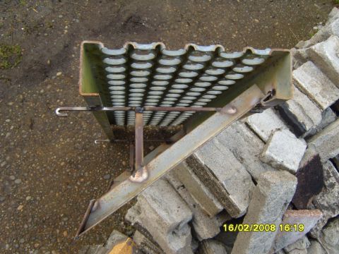 1989 Ford Bronco - Metal step platform with holes, likely a custom fabrication, sits on a pile of bricks.