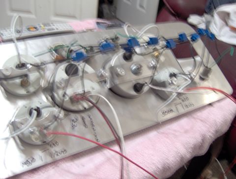 1978 Ford Bronco - Wiring and gauges laid out on a surface, possibly for installation or testing.