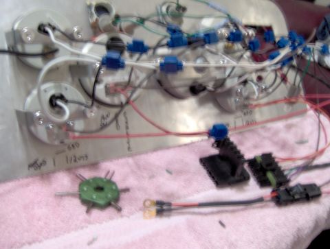 1978 Ford Bronco - A close-up view of a vehicle's dashboard wiring harness, showing numerous connections and wires.