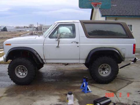 1983 Ford Bronco - Fender flares on, but sagging in the rear. The lift used the stock wedge and a 4" block in the rear.