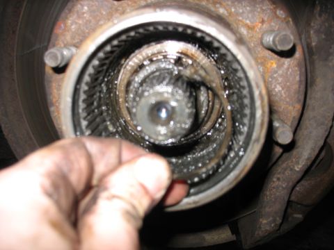 1995 Ford C-350 (Centurion Conversions) - Front axle hub assembly showing internal splines, likely needing service.