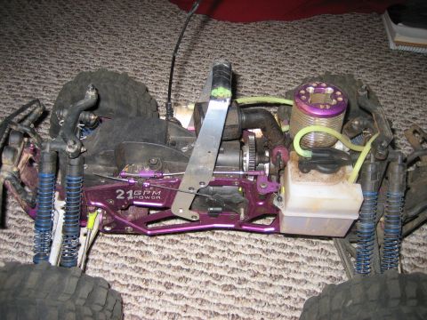 1996 Ford Bronco - Close-up of a remote control car's chassis and engine, purple accents and a "21 GPM POWER" label.