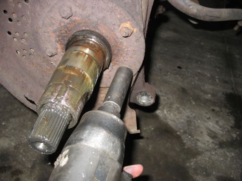 1995 Ford C-350 (Centurion Conversions) - Working on a front axle assembly with an impact wrench.
