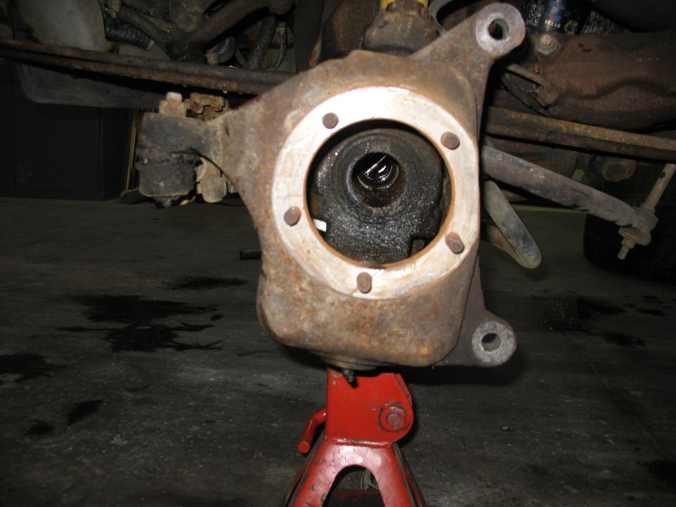 Front axle spindle on red jack stand