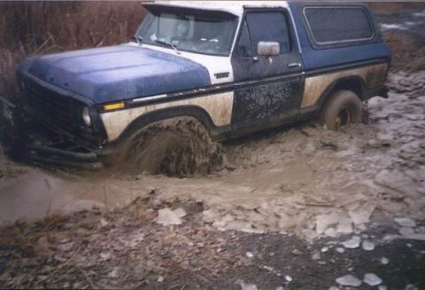 1978 Ford Bronco - This 1978 Ford Bronco is stuck in deep mud, with its front wheel submerged.