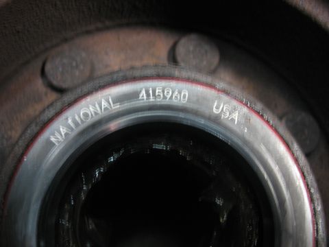 1995 Ford C-350 (Centurion Conversions) - A close-up view of a National brand wheel bearing, marked with its part number and country of origin.