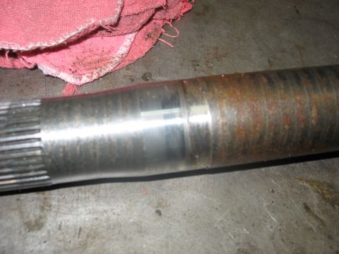 1995 Ford C-350 (Centurion Conversions) - This axle shaft shows signs of wear and rust, indicating it may need replacement or repair.