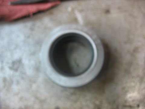 1995 Ford C-350 (Centurion Conversions) - A close-up view of a metal bearing part, likely for a vehicle's front axle rebuild.