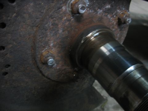 1995 Ford C-350 (Centurion Conversions) - This image shows a heavily rusted wheel hub and axle component, likely from a vehicle undergoing maintenance.