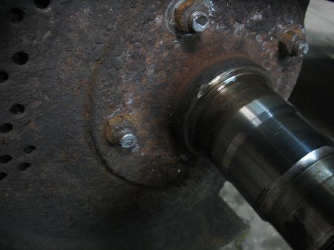1995 Ford C-350 (Centurion Conversions) - A close-up view of a corroded metal part, possibly from a vehicle's axle or hub assembly.