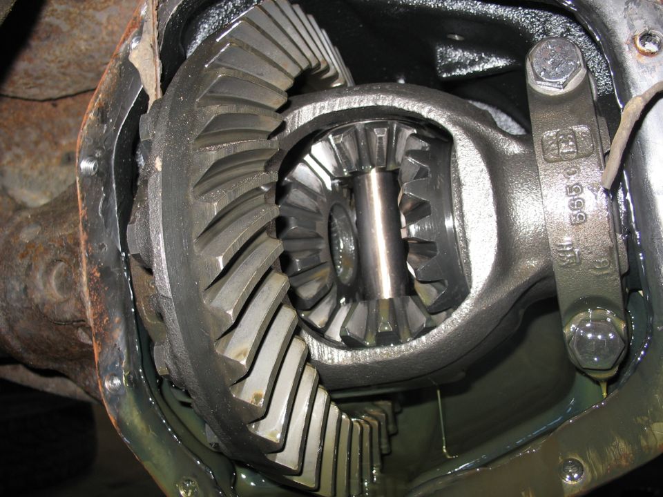 Close-up of differential gears with visible part number 'WH 565C'