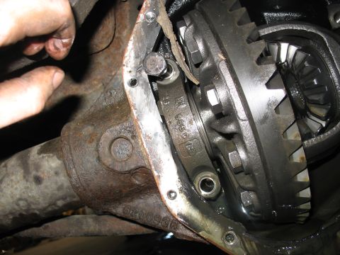 1995 Ford C-350 (Centurion Conversions) - Close-up view of differential gears with a visible part number, likely during a rebuild.