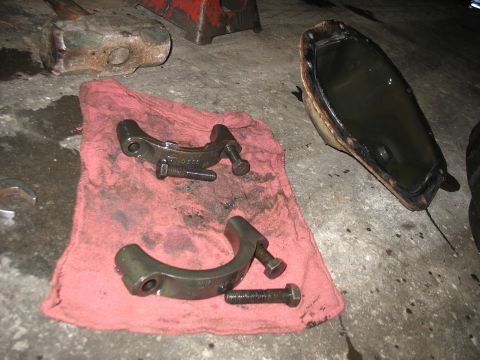 1995 Ford C-350 (Centurion Conversions) - Automotive parts are laid out on a rag, with a pan of fluid nearby, suggesting a repair or maintenance task.