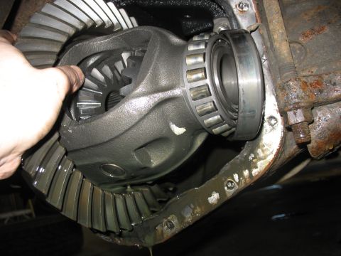 1995 Ford C-350 (Centurion Conversions) - The differential housing is open, revealing the ring gear and pinion gear assembly with a bearing.