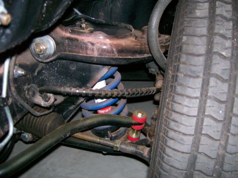 1978 Ford Mustang II - This image shows the suspension system of a vehicle, including the shock absorber, springs, and sway bar components.