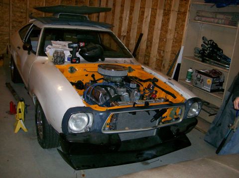 1978 Ford Mustang II - This 1978 Ford Mustang II is shown with its hood open, revealing the engine bay.