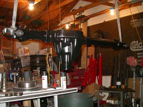 1990 Ford Bronco - Dana 60 hanging from the rafters for painting. It's much easier to paint it hanging because you can paint all sides of it at once.