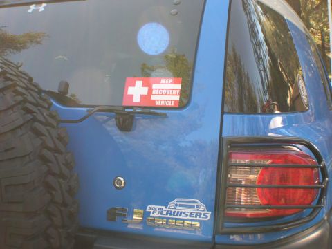 2007 Toyota FJ Cruiser - Rear view of a blue 2007 Toyota FJ Cruiser, showing its spare tire and club stickers.