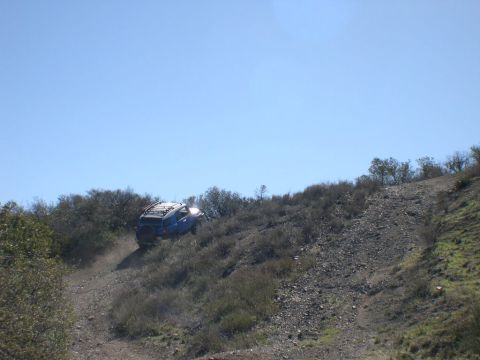 2007 Toyota FJ Cruiser - Blue 2007 Toyota FJ Cruiser navigating a challenging off-road incline.