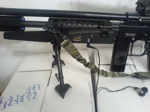 1985 Ford Bronco - A paintball gun is shown with a bipod and a Yukon night vision attachment, along with a sling and earbuds.