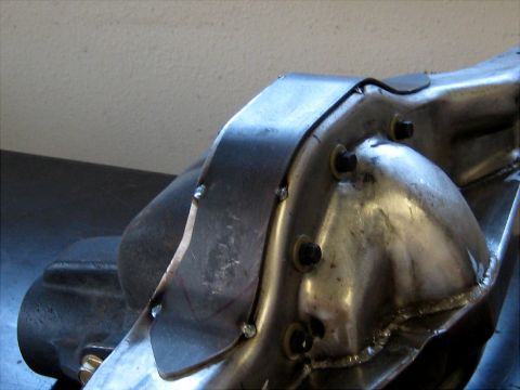 1996 Ford Bronco - Close-up view of a metal differential housing with a custom bracket attached.