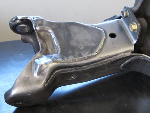 1996 Ford Bronco - Close-up of a metal suspension component with extensive welding.