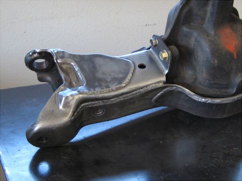 1996 Ford Bronco - This image shows a close-up view of a modified front suspension part, highlighting the welding work.