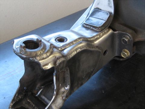 1996 Ford Bronco - Heavily welded suspension part shown in detail, likely a custom or repaired component.