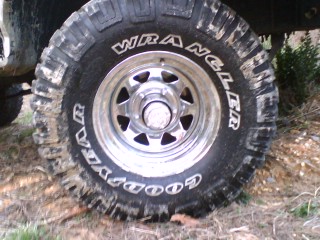1990 Ford Bronco - Goodyear Wrangler MTR tire mounted on a vehicle's wheel.