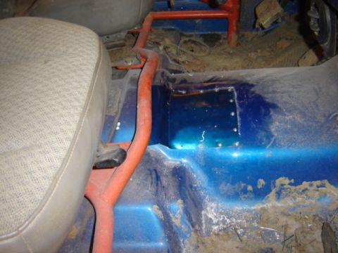 1992 Ford Bronco - Interior view showing floor, seat, and roll bar. Rust is present on the floor.