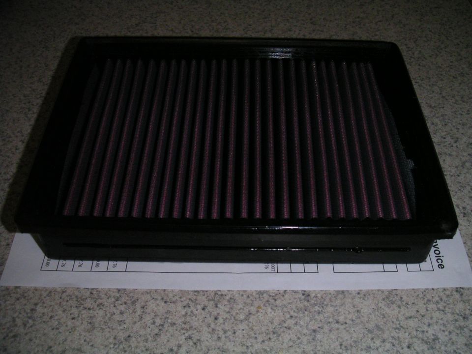 Black air filter with red filter media