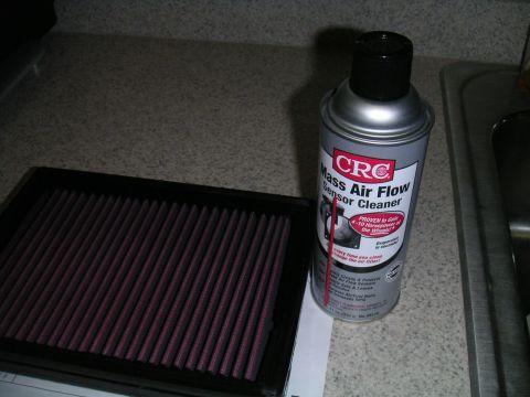 2002 BMW M3 - CRC Mass Air Flow Sensor Cleaner and an air filter are on a countertop.