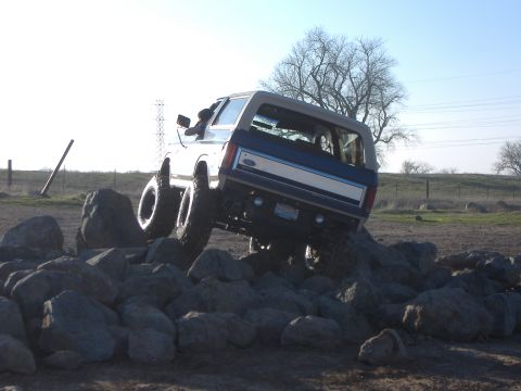 1986 Ford Bronco - This 1980s Ford Bronco is navigating a challenging rocky terrain.