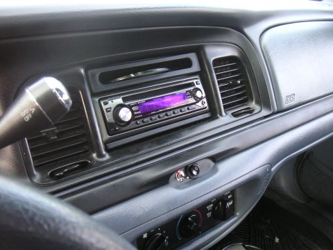 1997 Ford Crown Victoria - Interior view of a 1997 Ford Crown Victoria, highlighting the dashboard and stereo system.