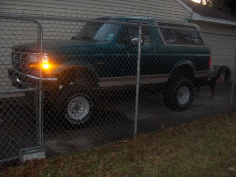 1996 Ford Bronco - This 1996 Ford Bronco is parked behind a fence in a residential area.