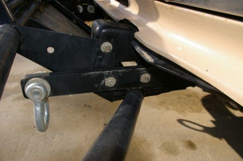 1986 Ford Bronco - Tow hitch mount with shackle, part of a vehicle's undercarriage.