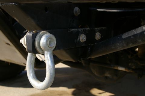 1986 Ford Bronco - A heavy-duty tow hook is mounted to the vehicle's chassis, ready for towing or recovery operations.