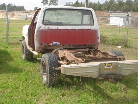 1989 Ford Bronco - This is the rear chassis of a pickup truck, showing significant rust and wear. A "Shoar Sheriff" bumper sticker is visible on the rear bump…