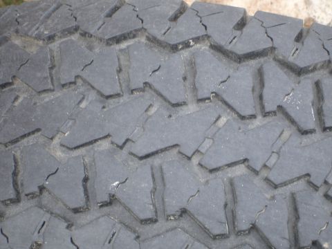 1989 Ford Bronco - Close-up of a tire tread shows wear and cracking, with a watermark at the bottom right.