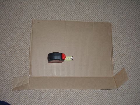 1998 BMW R1100GS ABS - A tape measure rests on a piece of cardboard laid out on a carpeted floor.
